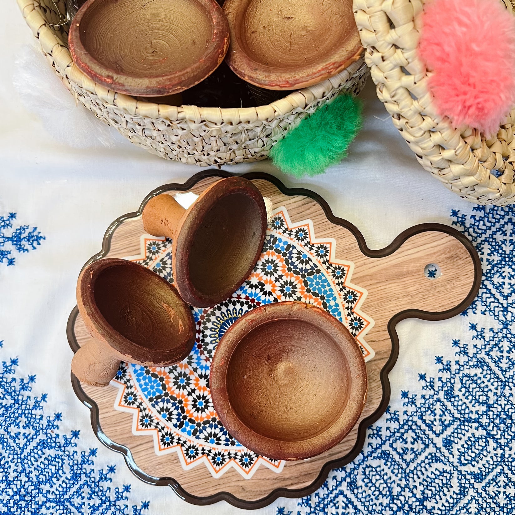 Aker Fassi clay in a small pot on a wooden surface